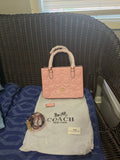Cartera coach mediana