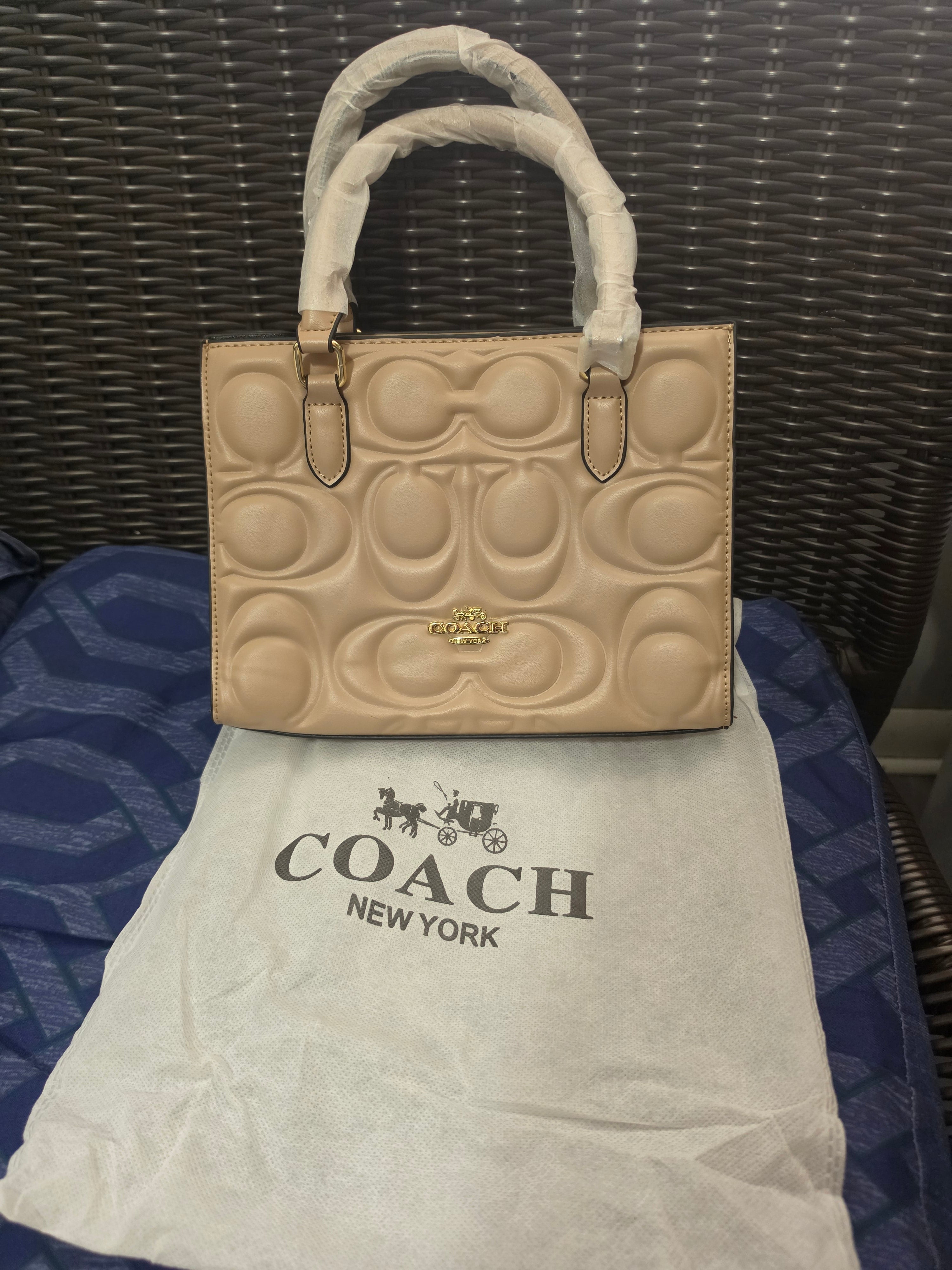 Cartera coach mediana